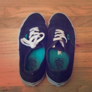 Black, white, and blue Vans